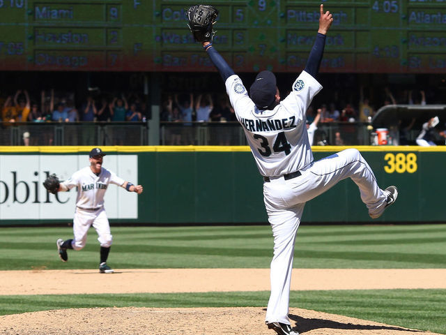 SEATTLE, WA - AUGUST 15: Starting pitcher Felix Hernandez #34 of the Seattle Mariners celebrates after throwing a perfect game against the Tampa Bay Rays at Safeco Field on August 15, 2012 in Seattle, Washington.