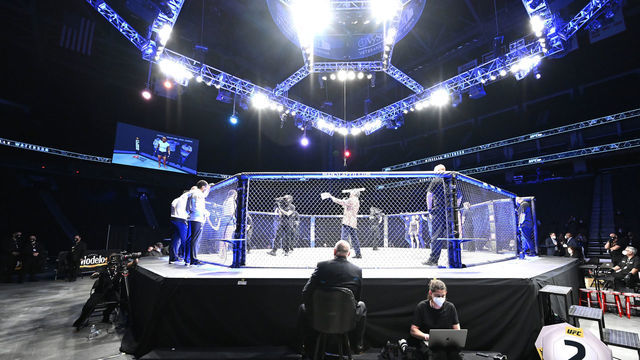 JACKSONVILLE, FLORIDA - MAY 09: UFC Octagon announcer Bruce Buffer introduces Carla Esparza of the United States and Michelle Waterson of the United States in their Women's strawweight fight during UFC 249 at VyStar Veterans Memorial Arena on May 09, 2020 in Jacksonville, Florida.