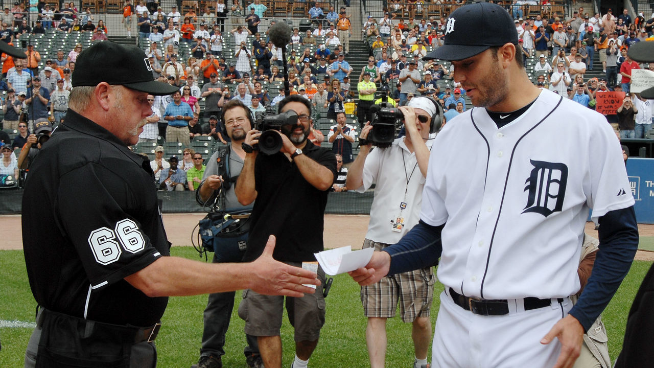 DETROIT - JUNE 03: Major League umpire Jim Joyce #66 receives the games line-up card from pitcher Armando Galarraga #58 of the Detroit Tigers before the start of the game against the Cleveland Indians at Comerica Park on June 3, 2010 in Detroit, Michigan. The Tigers defeated the Indians 12-6.