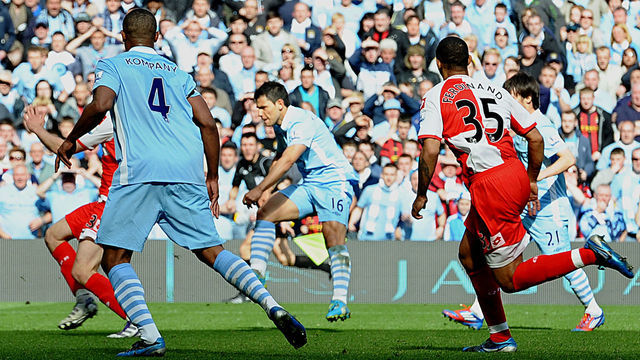 Manchester City's Argentinian striker Sergio Aguero (3rd R) scores their late winning goal during the English Premier League football match between Manchester City and Queens Park Rangers at The Etihad stadium in Manchester, north-west England on May 13, 2012. Manchester City won the game 3-2 to secure their first title since 1968. This is the first time that the Premier league title has been decided on goal-difference, Manchester City and Manchester United both finishing on 89 points. AFP PHOTO/PAUL ELLIS AFP PHOTO/PAUL ELLIS RESTRICTED TO EDITORIAL USE. No use with unauthorized audio, video, data, fixture lists, club/league logos or 'live' services. Online in-match use limited to 45 images, no video emulation. No use in betting, games or single club/league/player publications.