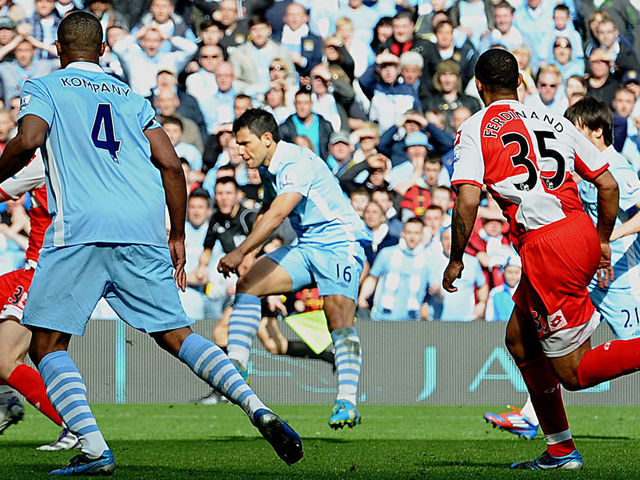 Manchester City's Argentinian striker Sergio Aguero (3rd R) scores their late winning goal during the English Premier League football match between Manchester City and Queens Park Rangers at The Etihad stadium in Manchester, north-west England on May 13, 2012. Manchester City won the game 3-2 to secure their first title since 1968. This is the first time that the Premier league title has been decided on goal-difference, Manchester City and Manchester United both finishing on 89 points. AFP PHOTO/PAUL ELLIS AFP PHOTO/PAUL ELLIS RESTRICTED TO EDITORIAL USE. No use with unauthorized audio, video, data, fixture lists, club/league logos or 'live' services. Online in-match use limited to 45 images, no video emulation. No use in betting, games or single club/league/player publications.