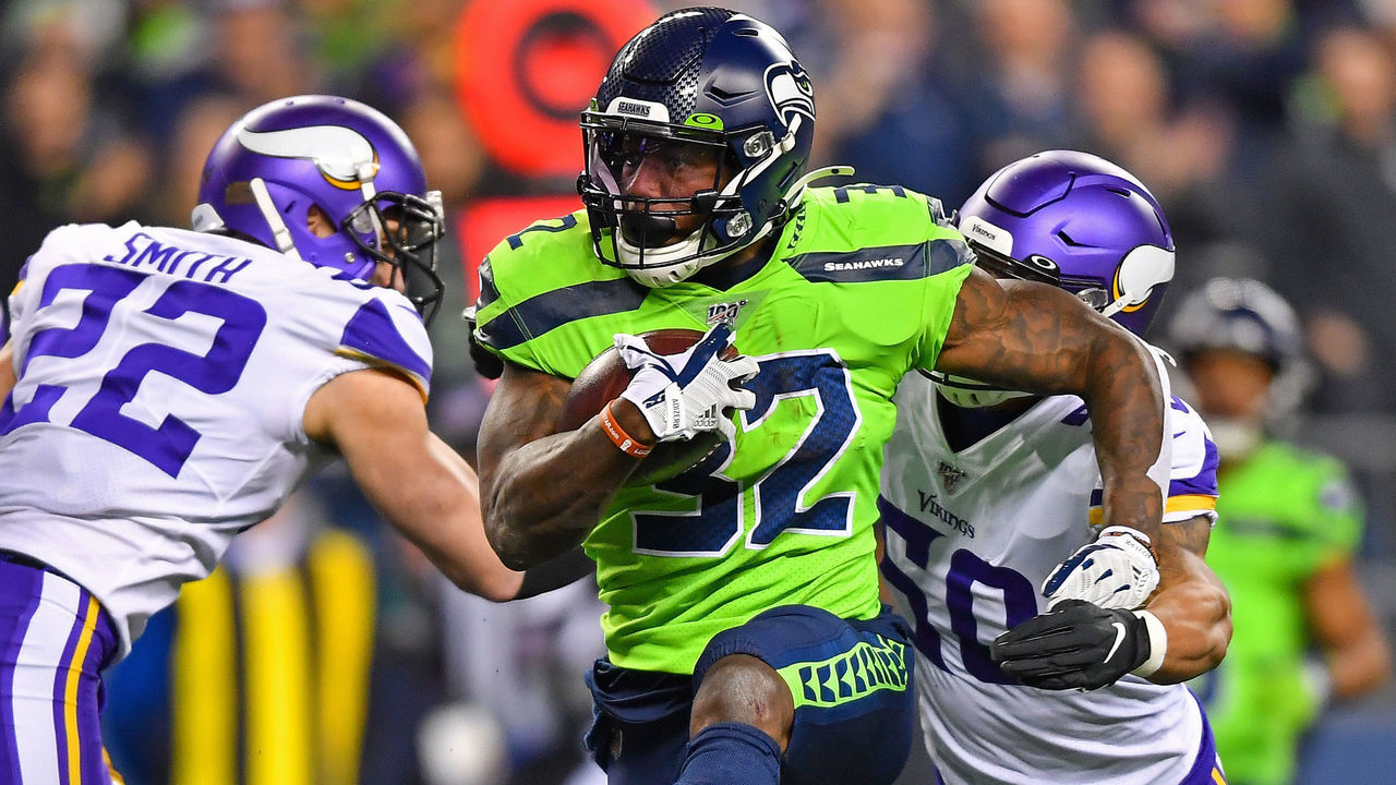 SEATTLE, WASHINGTON - DECEMBER 02: Chris Carson #32 of the Seattle Seahawks high steps his way to more yard during the game against the Minnesota Vikings at CenturyLink Field on December 02, 2019 in Seattle, Washington. The Seattle Seahawks won, 37-30.
