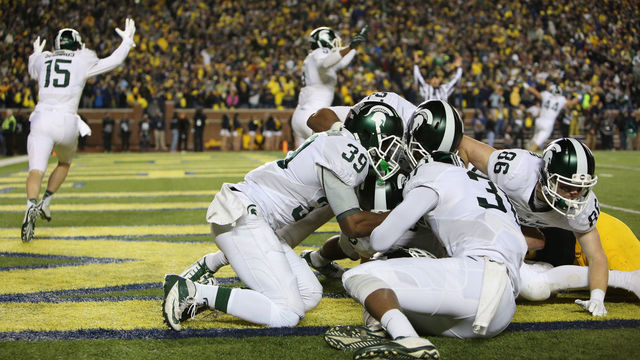 ANN ARBOR, MI - OCTOBER 17: The Michigan State Spartans celebrate in the endzone after defensive back Jalen Watts-Jackson #20 scored the game winning touchdown against the Michigan Wolverines during the final seconds of college football game at at Michigan Stadium on October 17, 2015 in Ann Arbor, Michigan.