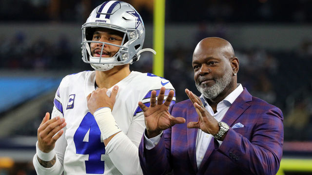 ARLINGTON, TEXAS - NOVEMBER 28: Dak Prescott #4 of the Dallas Cowboys waits for the ball with former Cowboys running back Emmitt SMith before the game against the Buffalo Bills at AT&T Stadium on November 28, 2019 in Arlington, Texas.