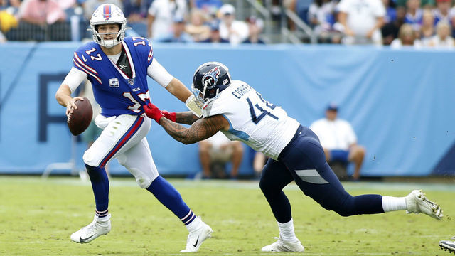 NASHVILLE, TN - OCTOBER 06: Buffalo Bills quarterback Josh Allen (17) escapes a tackle of Tennessee Titans outside linebacker Kamalei Correa (44) during a game between the Tennessee Titans and the Buffalo Bills on October 6, 2019, at Nissan Stadium in Nashville, Tennessee.