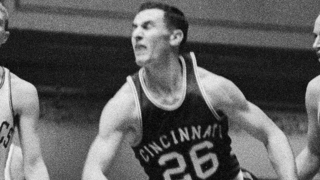 (Original Caption) Bill Sharmon (21) of the Boston Celtics, shooting a one handed jump shot as Tom Heinsohn (15) of the Celtics, Johnny McCarthy (26), and Jim Palmer (24), of the Cincinnati Royals, look on