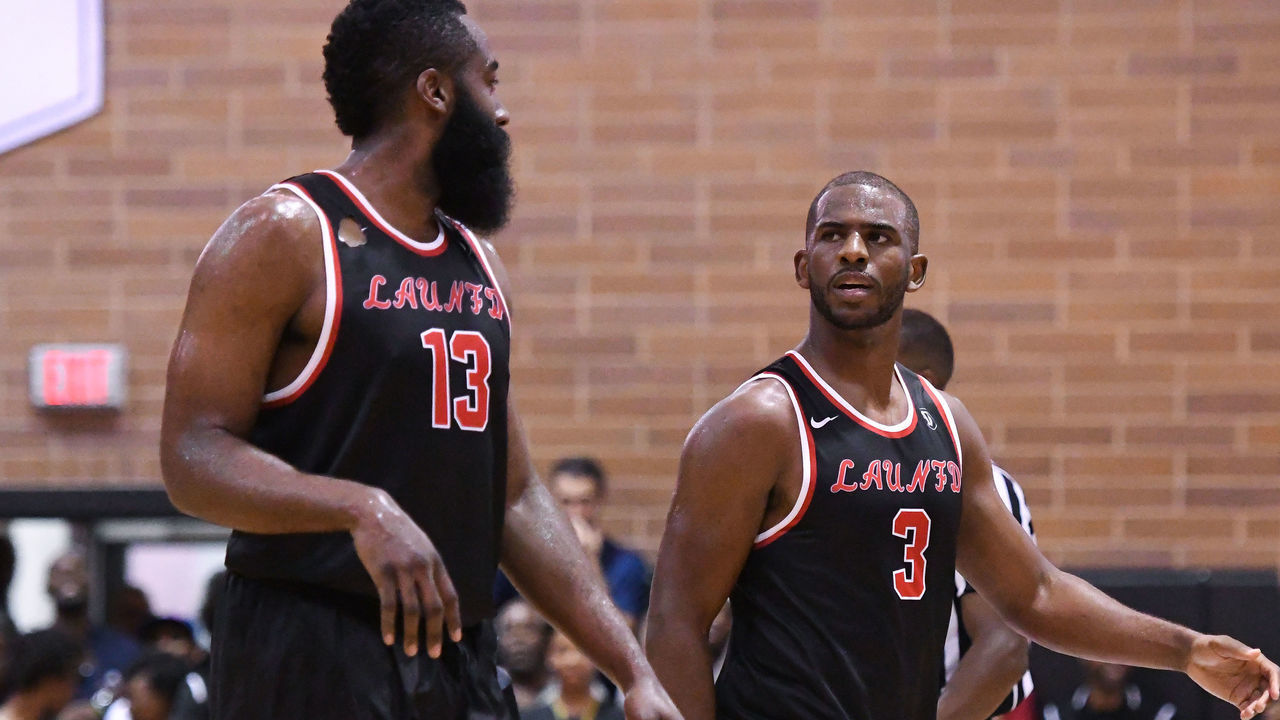 LOS ANGELES, CA - JULY 30: Houston Rockets guards Chris Paul (3) talks with James Harden (13) during a Drew League game at King Drew Magnet High School on July 30th, 2017.