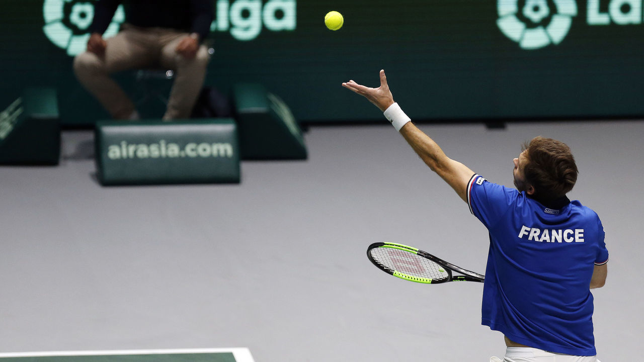 MADRID, SPAIN - 2019/11/19: Nicolas Mahut of France serves against Yasutaka Uchiyama and Ben McLachlan of Japan during Day 2 of the 2019 Davis Cup at La Caja Magica in Madrid. France wins 2-1.