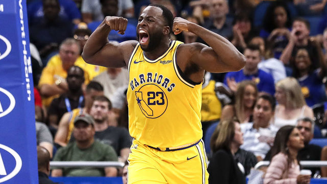 ORLANDO, FL - FEBRUARY 28: Draymond Green #23 of the Golden State Warriors flex his muscles after a score during the game against the Orlando Magic at the Amway Center on February 28, 2019 in Orlando, Florida. The Magic defeated the Warriors 103 to 96.