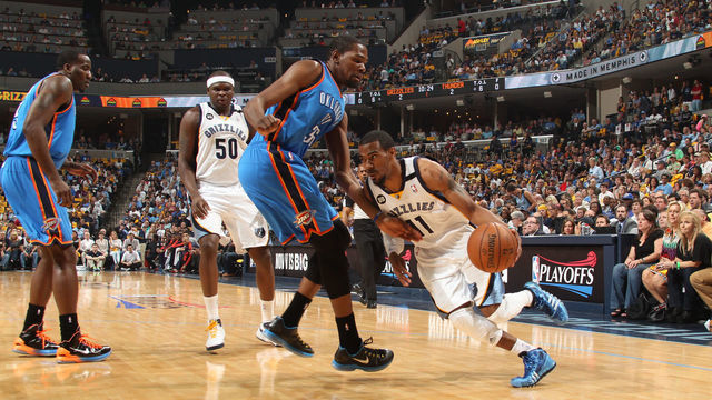 MEMPHIS, TN - MAY 11: Mike Conley #11 of the Memphis Grizzlies drives to the basket against Kevin Durant #35 of the Oklahoma City Thunder in Game Three of the Western Conference Semifinals during the 2013 NBA Playoffs on May 11, 2013 at FedExForum in Memphis, Tennessee. Mandatory Copyright Notice: Copyright 2013 NBAE