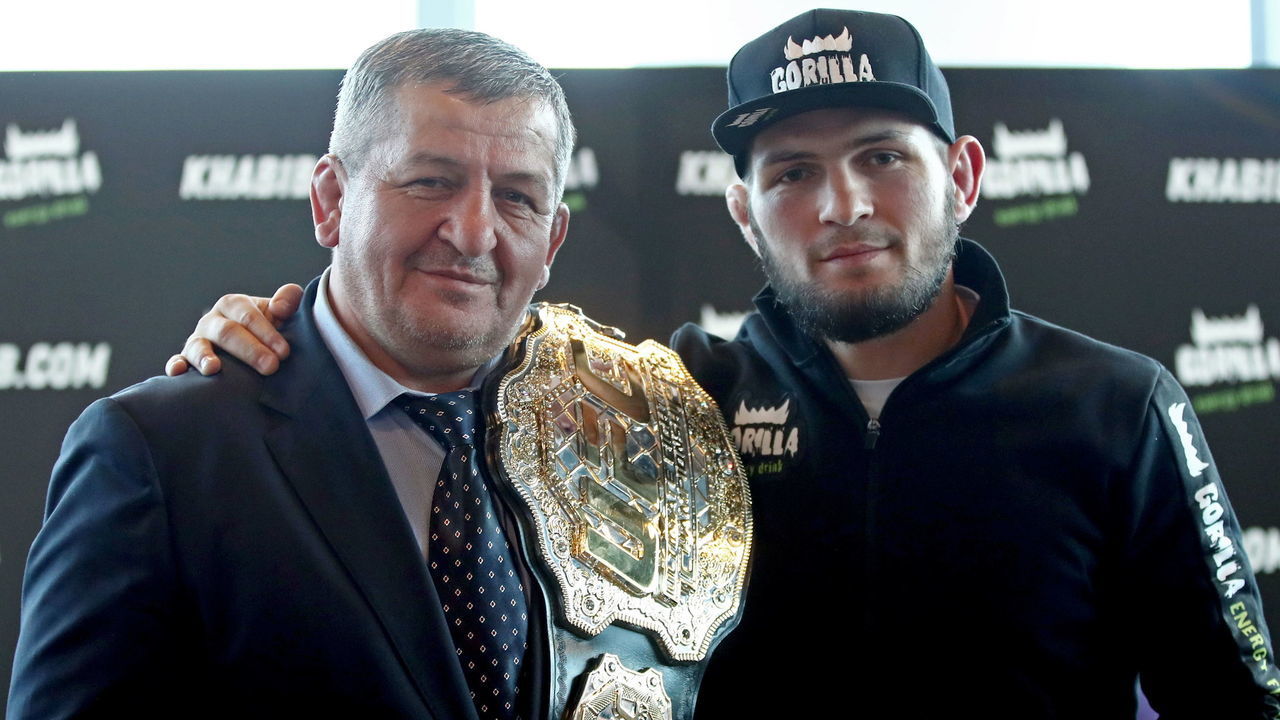 MOSCOW, RUSSIA NOVEMBER 26, 2018: Russian mixed martial artist and UFC lightweight champion Khabib Nurmagomedov (L) with his father and coach Abdulmanap Nurmagomedov at a news conference. Valery Sharifulin/TASS
