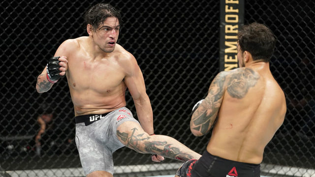 JACKSONVILLE, FLORIDA - MAY 13: (L-R) Gabriel Benitez of Mexico kicks Omar Morales of Venezuela in their lightweight bout during the UFC Fight Night Event at VyStar Veterans Memorial Arena on May 13, 2020 in Jacksonville, Florida.