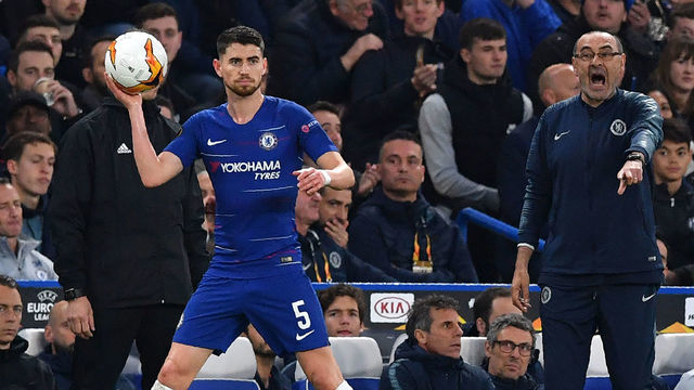 Chelsea's Italian head coach Maurizio Sarri (R) reacts as Chelsea's Italian midfielder Jorginho takes a throw-in during the UEFA Europa League semi-final second leg football match between Chelsea and Eintracht Frankfurt at Stamford Bridge in London on May 9, 2019.