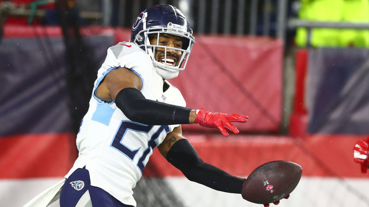 FOXBOROUGH, MASSACHUSETTS - JANUARY 04: Logan Ryan #26 of the Tennessee Titans celebrates his touchdown against the New England Patriots in the fourth quarter of the AFC Wild Card Playoff game at Gillette Stadium on January 04, 2020 in Foxborough, Massachusetts.