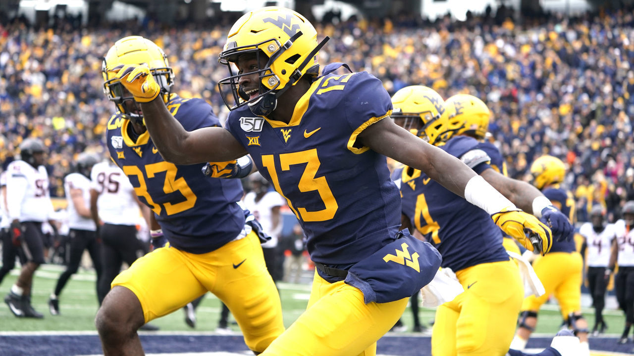 MORGANTOWN, WV - NOVEMBER 23: West Virginia Mountaineers Wide Receiver Sam James (13) celebrates making a gain to the goal line during the first half of the college football game between the Oklahoma Cowboys and the West Virginia Mountaineers on November 23, 2019, at Milan Puskar Stadium in Morgantown, WV.