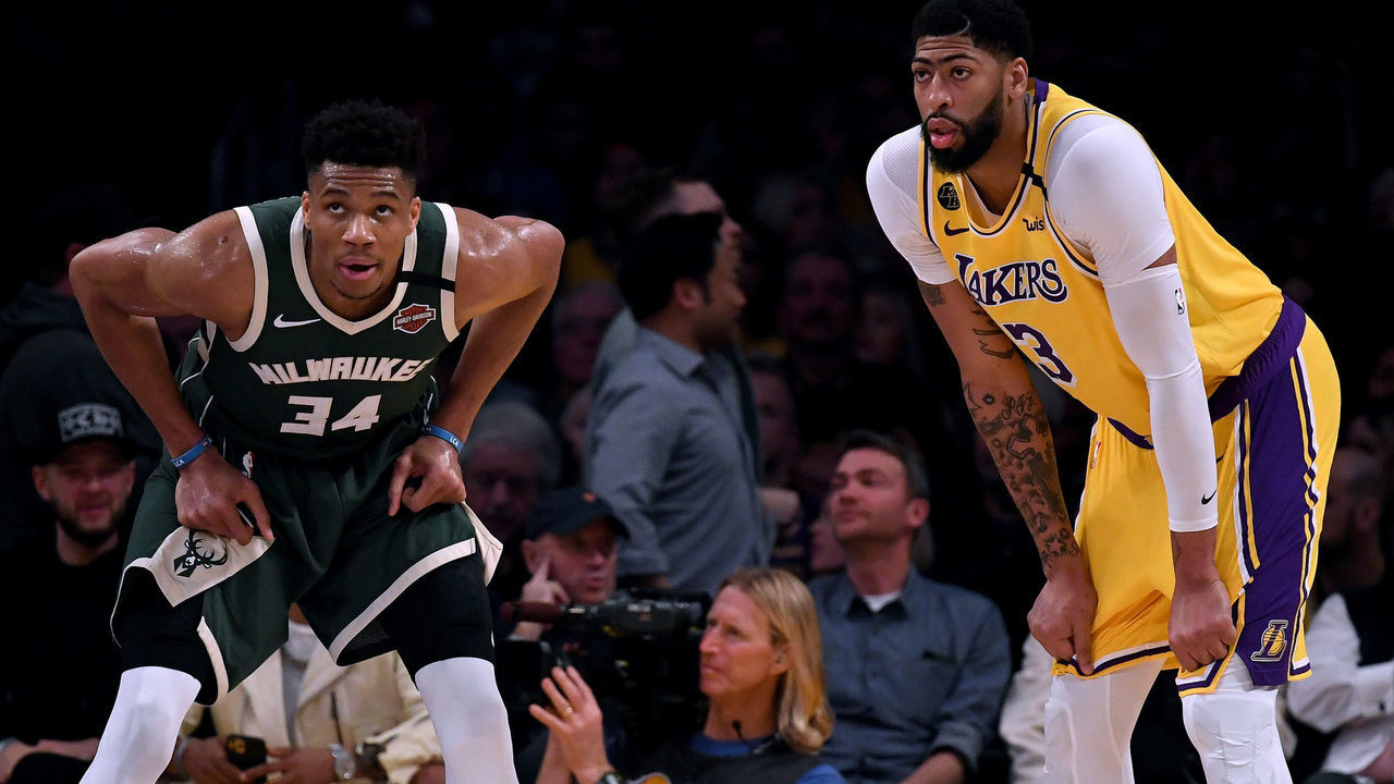 LOS ANGELES, CALIFORNIA - MARCH 06: Giannis Antetokounmpo #34 of the Milwaukee Bucks and Anthony Davis #3 of the Los Angeles Lakers wait during the third quarter at Staples Center on March 06, 2020 in Los Angeles, California.
