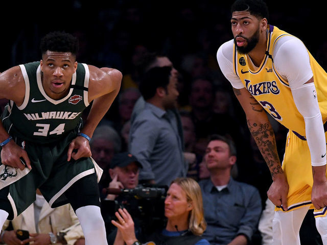 LOS ANGELES, CALIFORNIA - MARCH 06: Giannis Antetokounmpo #34 of the Milwaukee Bucks and Anthony Davis #3 of the Los Angeles Lakers wait during the third quarter at Staples Center on March 06, 2020 in Los Angeles, California.