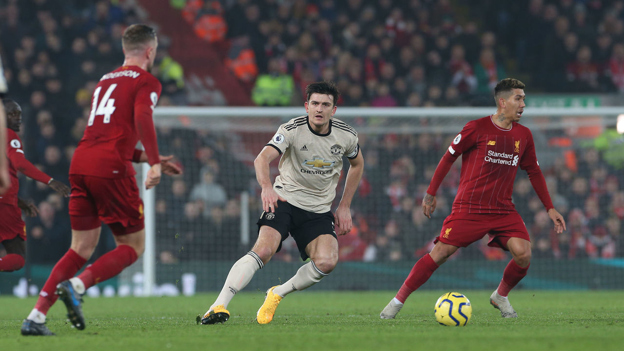 LIVERPOOL, ENGLAND - JANUARY 19: Harry Maguire of Manchester United in action with Jordan Henderson of Liverpool during the Premier League match between Liverpool FC and Manchester United at Anfield on January 19, 2020 in Liverpool, United Kingdom.