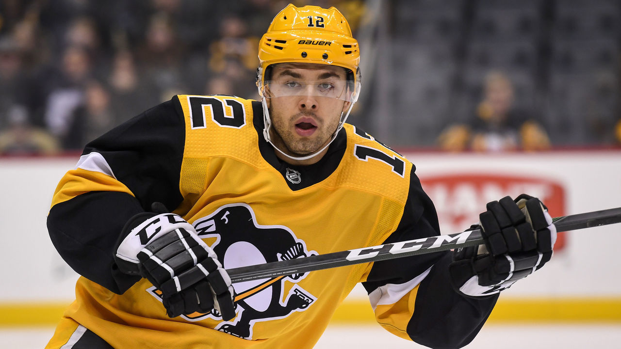 PITTSBURGH, PA - JANUARY 05: Pittsburgh Penguins Winger Dominik Simon (12) looks on during the first period in the NHL game between the Pittsburgh Penguins and the Florida Panthers on January 5, 2020, at PPG Paints Arena in Pittsburgh, PA.