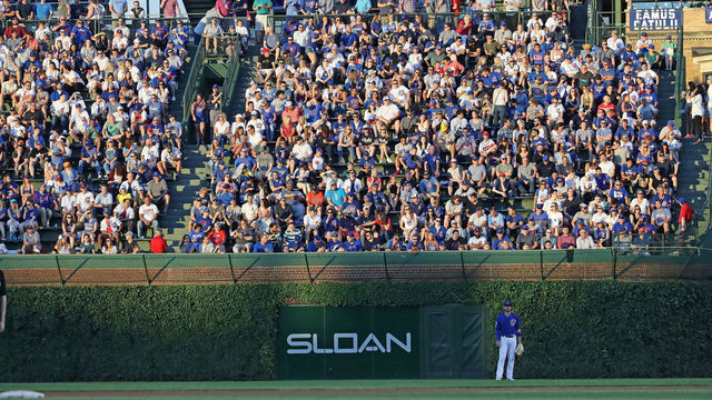 CHICAGO, ILLINOIS - JUNE 25: Fans in the outfield bleachers watch as the Chicago Cubs take on the Atlanta Braves at Wrigley Field on June 25, 2019 in Chicago, Illinois.