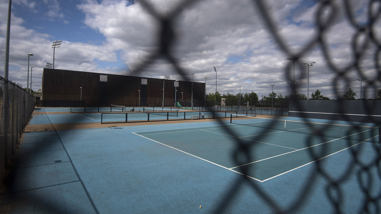 Tennis courts remain locked and empty at the Lee Valley Hockey and Tennis Centre in Queen Elizabeth Olympic Park, East London, on the first day of easing for some lockdown restrictions in England.