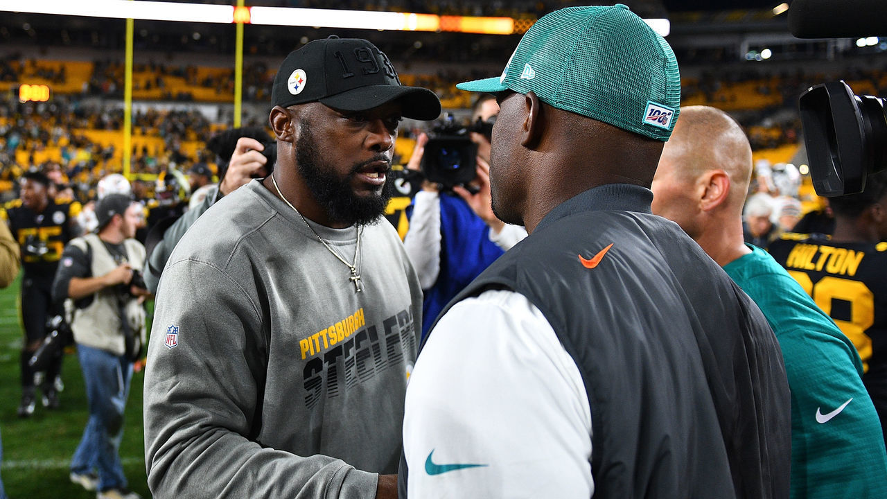 PITTSBURGH, PA - OCTOBER 28: Head coach Mike Tomlin of the Pittsburgh Steelers is congratulated by head coach Brian Flores of the Miami Dolphins after Pittsburgh's 27-14 win at Heinz Field on October 28, 2019 in Pittsburgh, Pennsylvania.