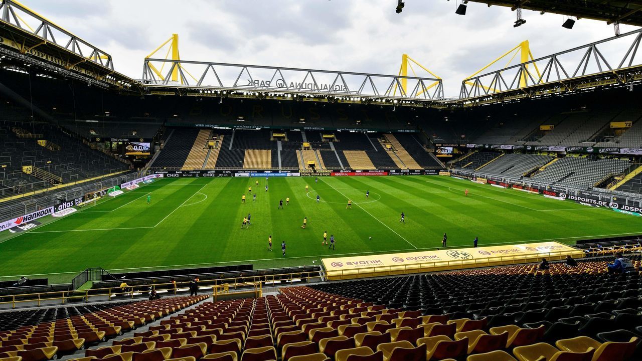 Empty seats are seen in the Signal Iduna Park without spectators during the German first division Bundesliga football match BVB Borussia Dortmund v Schalke 04 on May 16, 2020 in Dortmund, western Germany as the season resumed following a two-month absence due to the novel coronavirus COVID-19 pandemic.