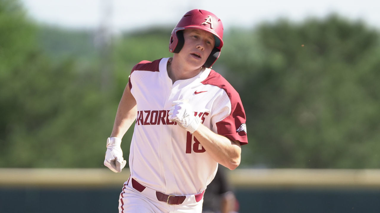 FAYETTEVILLE, AR - JUNE 10: Arkansas Razorbacks outfielder Heston Kjerstad (18) rounds third base after hitting a homerun during Game 3 of the NCAA Super Regional baseball game between the Arkansas Razorbacks and Ole Miss Rebels on June 10, 2019 at Baum Stadium in Fayetteville, AR.