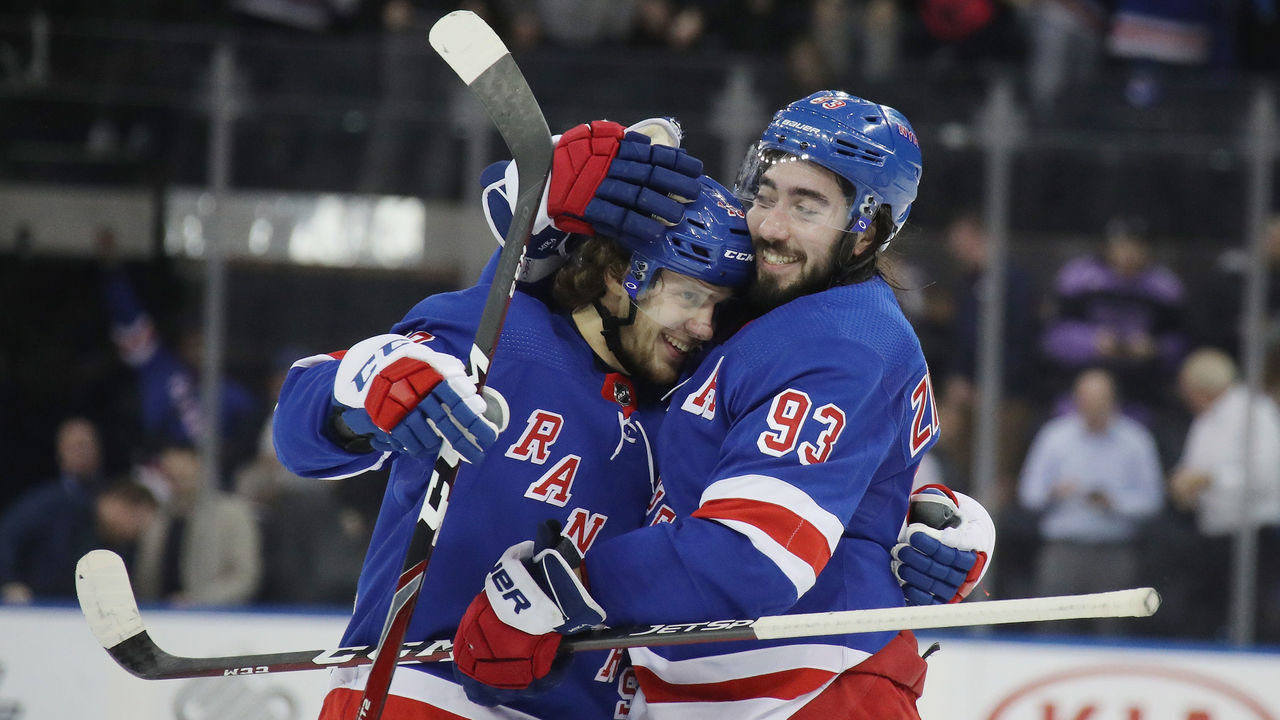 NEW YORK, NEW YORK - MARCH 05: Artemi Panarin #10 and Mika Zibanejad #93 of the New York Rangers celebrate a 5-4 overtime victory over the Washington Capitals at Madison Square Garden on March 05, 2020 in New York City.