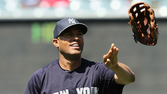 ANAHEIM, CA - JUNE 15: Pitcher Mariano Rivera #42 of the New York Yankees tosses his glove to a trainer prior to the MLB game against the Los Angeles Angels of Anaheim at Angel Stadium of Anaheim on June 15, 2013 in Anaheim, California. The Angels defeated the Yankees 6-2.