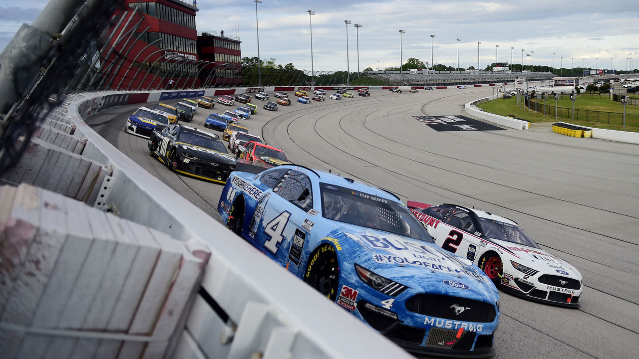 DARLINGTON, SOUTH CAROLINA - MAY 17: Kevin Harvick, driver of the #4 Busch Light YOURFACEHERE Ford, leads Brad Keselowski, driver of the #2 Discount Tire Ford, during the NASCAR Cup Series The Real Heroes 400 at Darlington Raceway on May 17, 2020 in Darlington, South Carolina. NASCAR resumes the season after the nationwide lockdown due to the ongoing coronavirus (COVID-19).