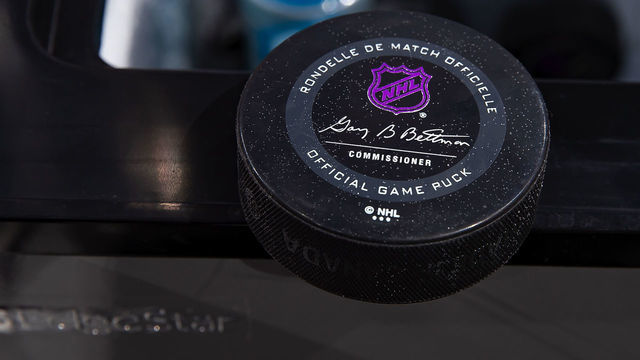 DETROIT, MI - NOVEMBER 08: A picture in the penalty box of this years official game pucks NHL logo turns purple once frozen before the start of an NHL game between the Detroit Red Wings and the Boston Bruins at Little Caesars Arena on November 8, 2019 in Detroit, Michigan. Detroit defeated Boston 4-2.