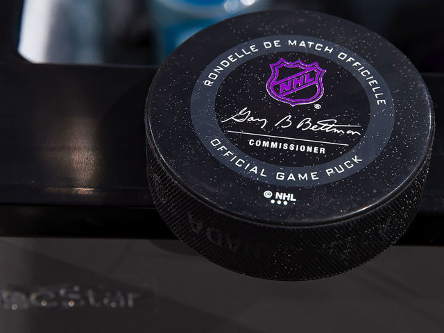 DETROIT, MI - NOVEMBER 08: A picture in the penalty box of this years official game pucks NHL logo turns purple once frozen before the start of an NHL game between the Detroit Red Wings and the Boston Bruins at Little Caesars Arena on November 8, 2019 in Detroit, Michigan. Detroit defeated Boston 4-2.