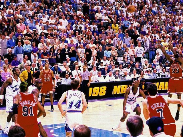 SALT LAKE CITY, UT - JUNE 14: Michael Jordan #23 of the Chicago Bulls hits the game winning shot against the Utah Jazz during Game Six of the 1998 NBA Finals played June 14, 1998 at the Delta Center in Salt Lake City, Utah. The Chicago Bulls defeated the Utah Jazz 4-2 to win the NBA Championship. NOTE TO USER: User expressly acknowledges that, by downloading and or using this photograph, User is consenting to the terms and conditions of the Getty Images License agreement. Mandatory Copyright Notice: Copyright 1998 NBAE