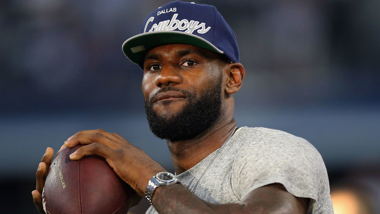 ARLINGTON, TX - SEPTEMBER 08: NBA player Lebron James of the Miami Heat throws a football at AT&T Stadium before a Sunday night game between the New York Giants and the Dallas Cowboys on September 8, 2013 in Arlington, Texas.