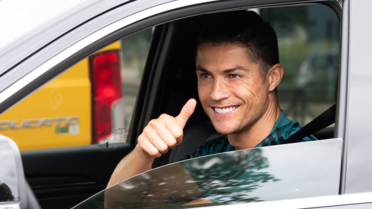 TURIN, ITALY - MAY 19: Juventus' Portuguese forward Cristiano Ronaldo exit in his car to resume training after a quarantine on May 19, 2020 at the club's Continassa training ground in Turin, as the country's lockdown is easing after over two months, aimed at curbing the spread of the COVID-19 infection, caused by the novel coronavirus. during the Cristiano Ronaldo arrival at the Turin on May 19, 2020 in Turin Italy