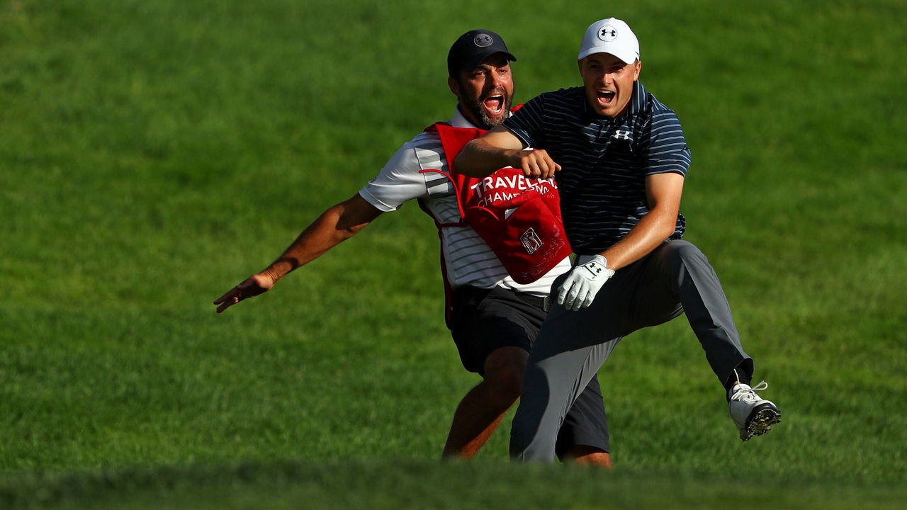 CROMWELL, CT - JUNE 25: Jordan Spieth of the United States celebrates with caddie Michael Greller after chipping in for birdie from a bunker on the 18th green to win the Travelers Championship in a playoff against Daniel Berger of the United States (not pictured) at TPC River Highlands on June 25, 2017 in Cromwell, Connecticut.