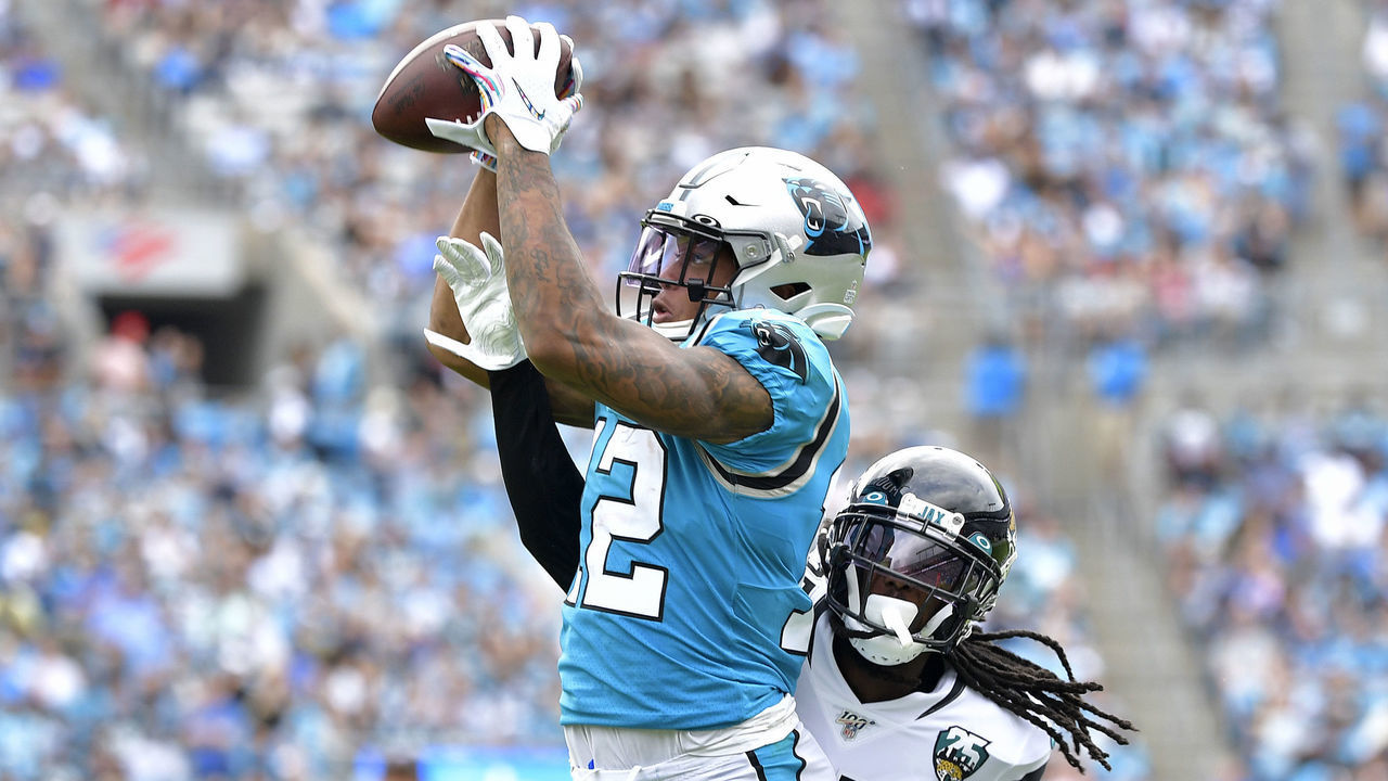 CHARLOTTE, NORTH CAROLINA - OCTOBER 06: D.J. Moore #12 of the Carolina Panthers makes a catch against Tre Herndon #37 of the Jacksonville Jaguars during the second half of their game at Bank of America Stadium on October 06, 2019 in Charlotte, North Carolina. The Panthers won 34-27.