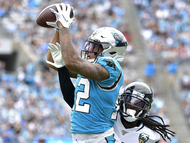 CHARLOTTE, NORTH CAROLINA - OCTOBER 06: D.J. Moore #12 of the Carolina Panthers makes a catch against Tre Herndon #37 of the Jacksonville Jaguars during the second half of their game at Bank of America Stadium on October 06, 2019 in Charlotte, North Carolina. The Panthers won 34-27.