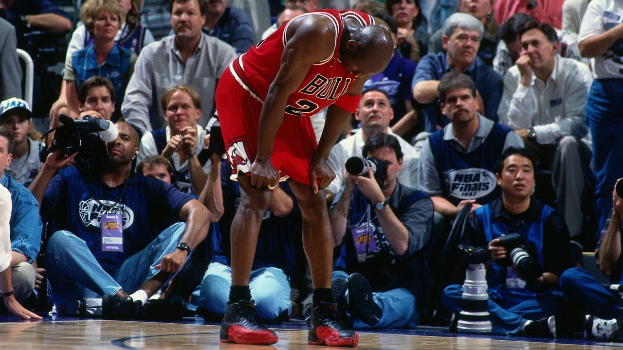 SALT LAKE CITY, UT - JUNE 11: Michael Jordan #23 of the Chicago Bulls rests during Game Five of the 1997 NBA Finals played against the Utah Jazz on June 11, 1997 at the Delta Center in Salt Lake City, Utah. The Chicago Bulls defeated the Utah Jazz 90-88. Mandatory Copyright Notice: Copyright 1997 NBAE