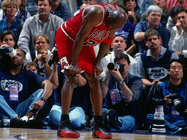 SALT LAKE CITY, UT - JUNE 11: Michael Jordan #23 of the Chicago Bulls rests during Game Five of the 1997 NBA Finals played against the Utah Jazz on June 11, 1997 at the Delta Center in Salt Lake City, Utah. The Chicago Bulls defeated the Utah Jazz 90-88. Mandatory Copyright Notice: Copyright 1997 NBAE