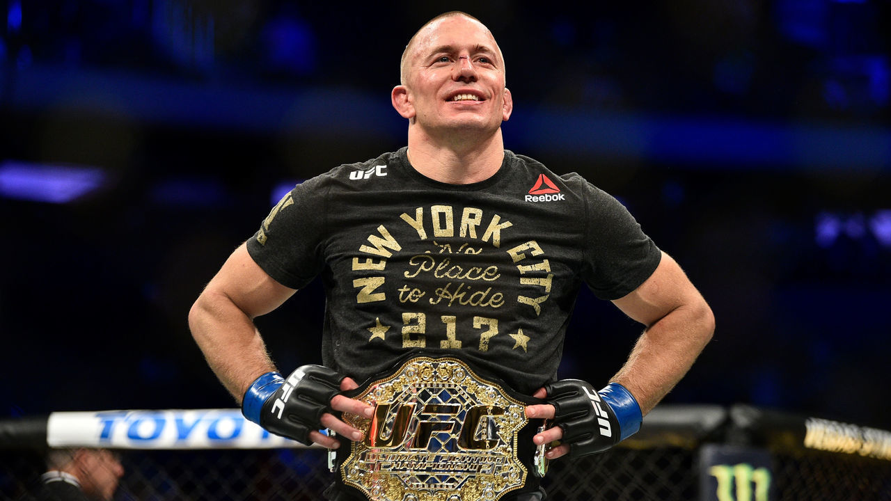 NEW YORK, NY - NOVEMBER 04: Georges St-Pierre of Canada celebrates after defeating Michael Bisping of England in their UFC middleweight championship bout during the UFC 217 event inside Madison Square Garden on November 4, 2017 in New York City.