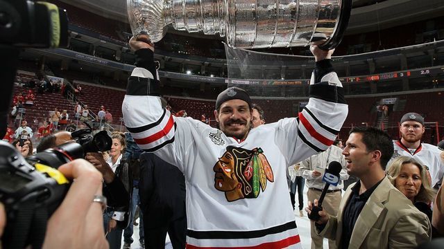 PHILADELPHIA - JUNE 09: Brent Sopel #5 of the Chicago Blackhawks hoists the Stanley Cup after teammate Patrick Kane scored the game-winning goal in overtime to defeat the Philadelphia Flyers 4-3 and win the Stanley Cup in Game Six of the 2010 NHL Stanley Cup Final at the Wachovia Center on June 9, 2010 in Philadelphia, Pennsylvania.