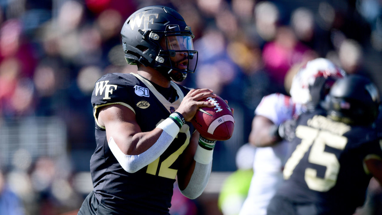 WINSTON SALEM, NORTH CAROLINA - NOVEMBER 02: Jamie Newman #12 of the Wake Forest Demon Deacons with the ball in the first quarter during their game against the North Carolina State Wolfpack at BB&T Field on November 02, 2019 in Winston Salem, North Carolina.