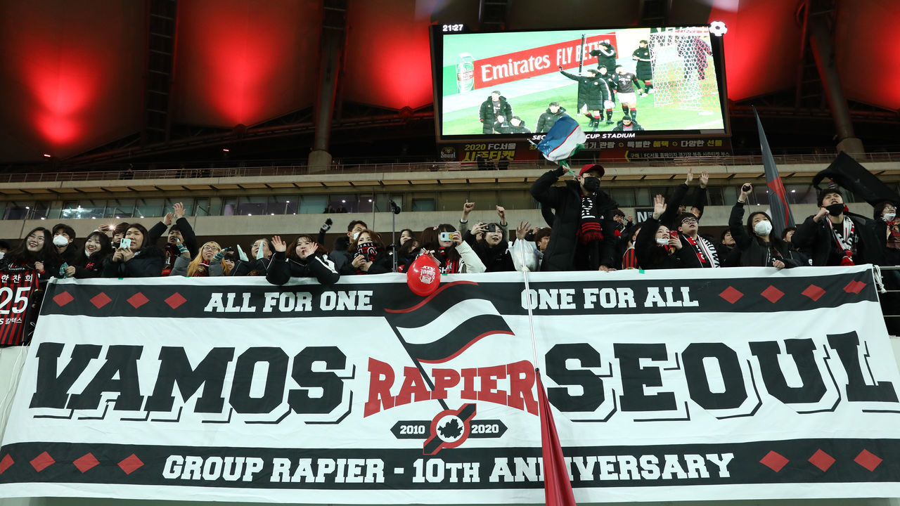 SEOUL, SOUTH KOREA - FEBRUARY 18: FC Seoul fans cheer after the AFC Champions League Group E match between FC Seoul and Melbourne Victory at the Seoul World Cup Stadium on February 18, 2020 in Seoul, South Korea.