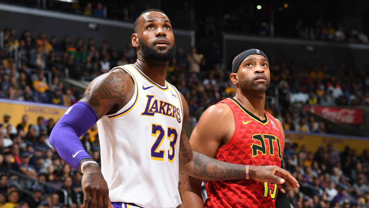 LOS ANGELES, CA - NOVEMBER 11: LeBron James #23 of the Los Angeles Lakers and Vince Carter #15 of the Atlanta Hawks look on on November 11, 2018 at STAPLES Center in Los Angeles, California. NOTE TO USER: User expressly acknowledges and agrees that, by downloading and/or using this Photograph, user is consenting to the terms and conditions of the Getty Images License Agreement. Mandatory Copyright Notice: Copyright 2018 NBAE