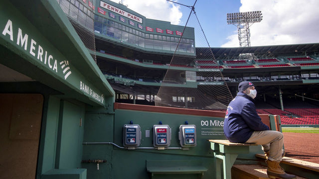 BOSTON, MA - APRIL 16: Mike Carpino from Boston Red Sox security surveys the field at Fenway Park on April 16, 2020. Fenway Park in Boston remains closed during the coronavirus emergency.
