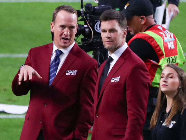 MIAMI GARDENS, FL - FEBRUARY 02: Tom Brady and Peyton Manning talk on the field during the 100 year team celebration prior to Super Bowl LIV on February 2, 2020 at Hard Rock Stadium in Miami Gardens, FL.