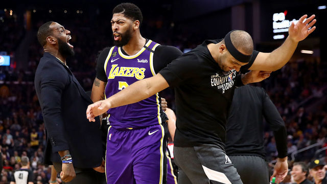 SAN FRANCISCO, CALIFORNIA - FEBRUARY 27: LeBron James #23, Anthony Davis #3 and Jared Dudley #10 of the Los Angeles Lakers react after Kyle Kuzma #0 dunked the ball during the second half of their game against the Golden State Warriors Chase Center on February 27, 2020 in San Francisco, California.