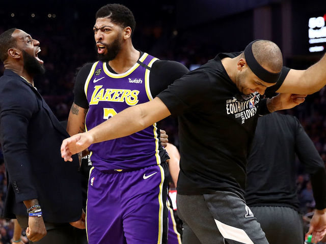SAN FRANCISCO, CALIFORNIA - FEBRUARY 27: LeBron James #23, Anthony Davis #3 and Jared Dudley #10 of the Los Angeles Lakers react after Kyle Kuzma #0 dunked the ball during the second half of their game against the Golden State Warriors Chase Center on February 27, 2020 in San Francisco, California.